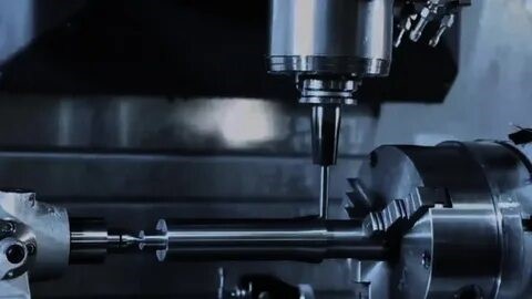 CNC prototype workshop showing machines and technicians